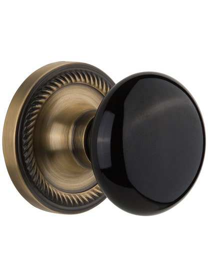 Rope Rose with Black Porcelain Knob in Antique Brass with .